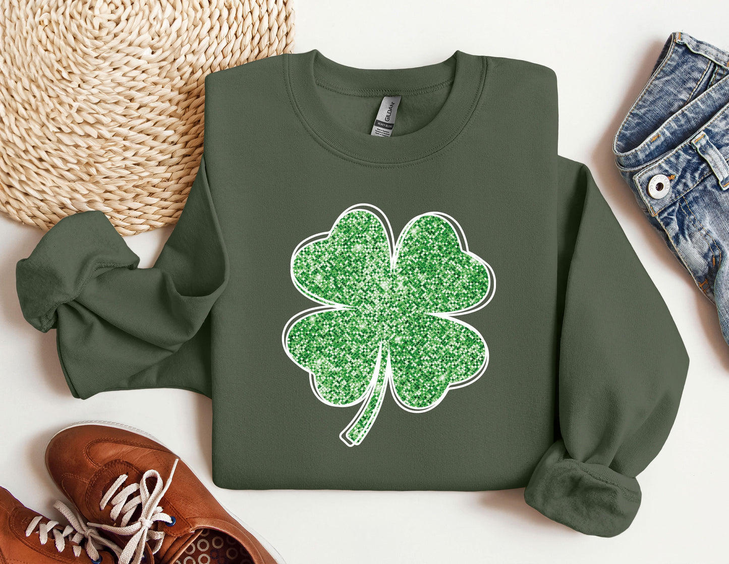 a green sweatshirt with a shamrock on it