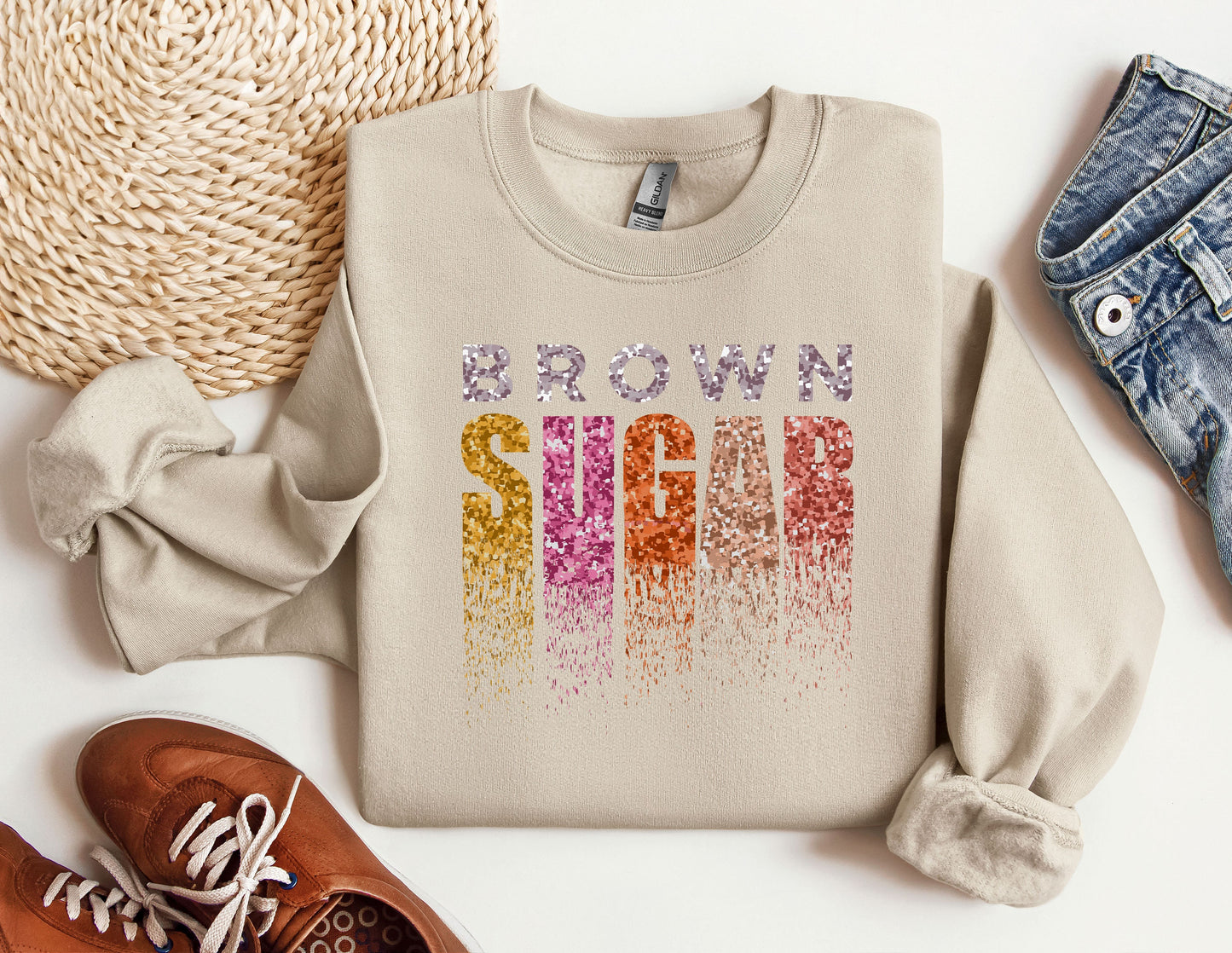 a sweater with the word iron sew on it next to a pair of shoes