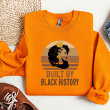 an orange shirt with a picture of a woman's face on it