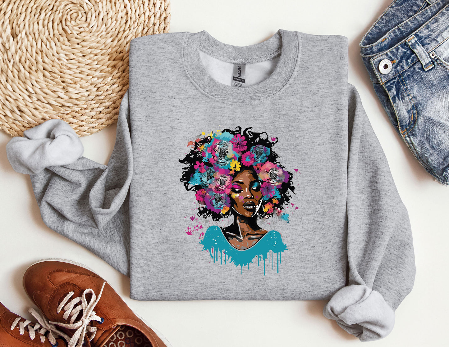 a sweatshirt with a picture of a woman with flowers on it