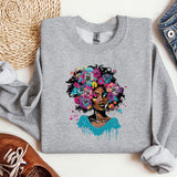 a sweatshirt with a picture of a woman with flowers on it