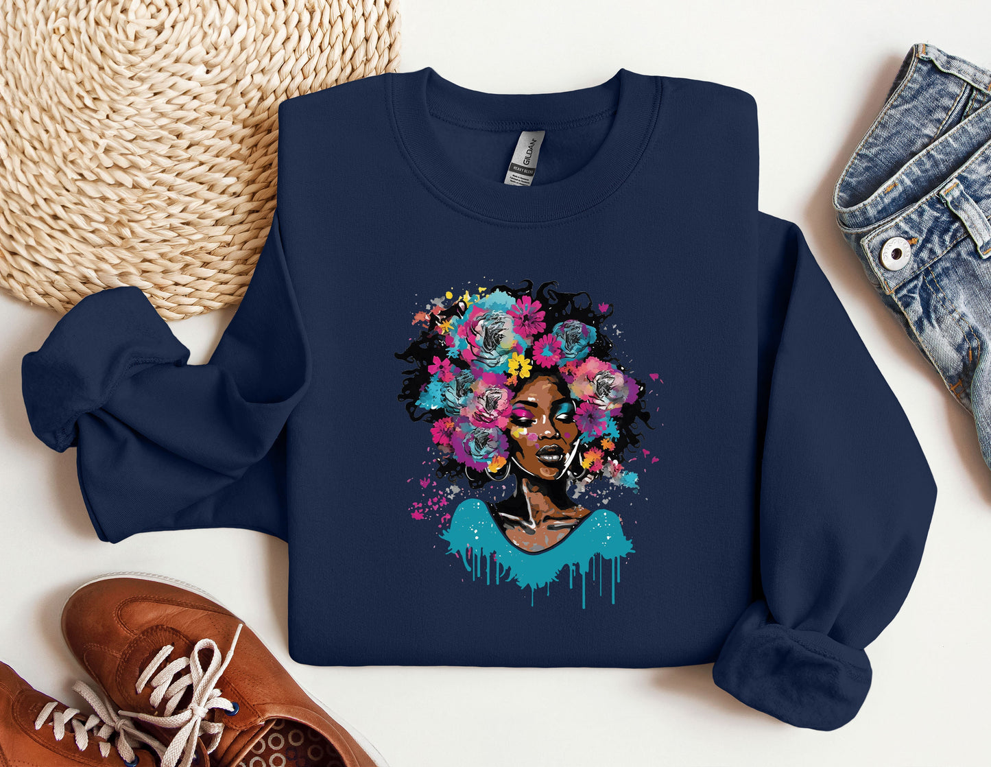 a blue sweatshirt with a picture of a woman with flowers on it