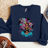 a blue sweatshirt with a picture of a woman with flowers on it