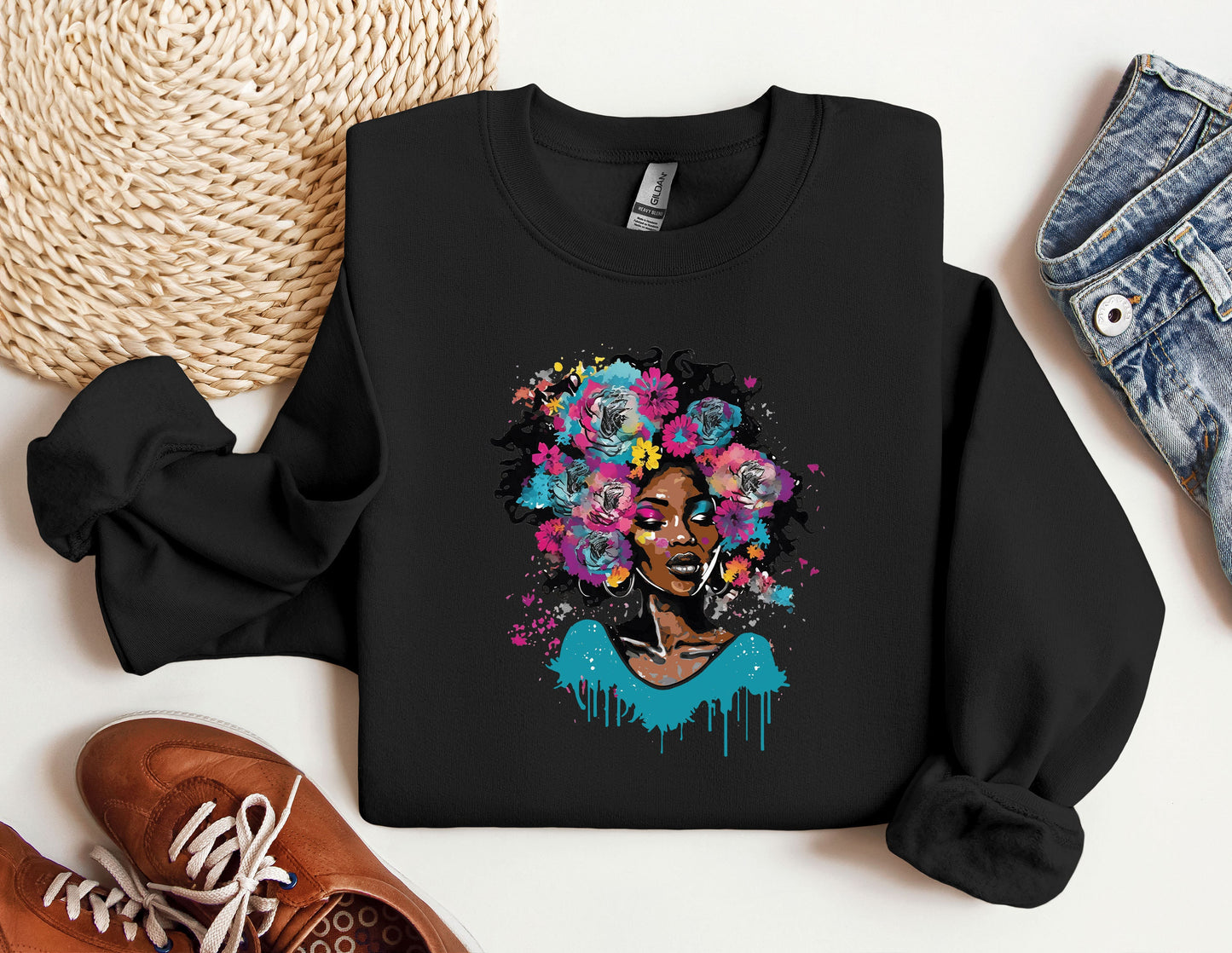 a black woman with flowers on her head wearing a sweatshirt