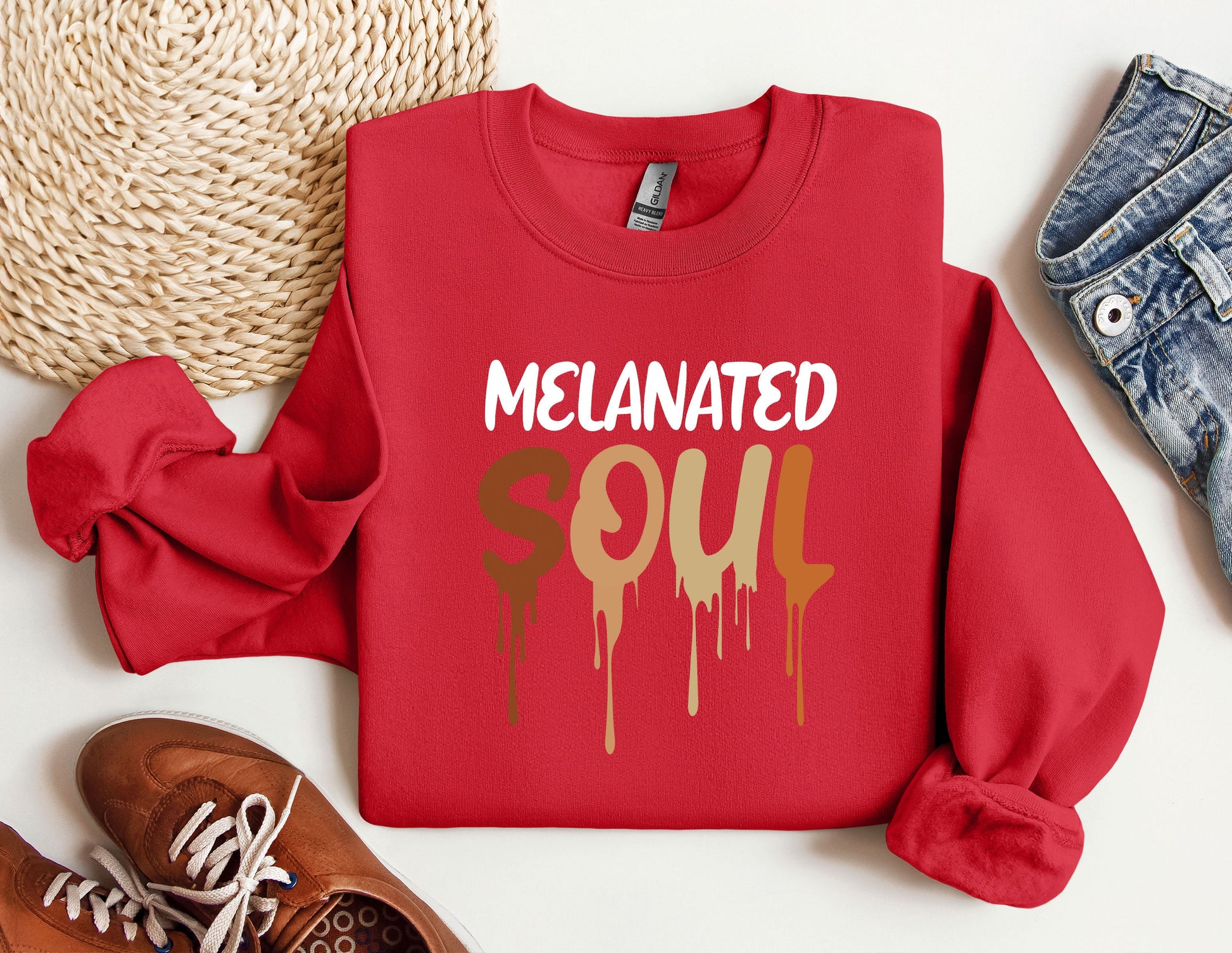 a red sweatshirt with the words melanited squ on it