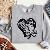 a sweater with a heart and a clover on it