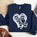 a blue sweatshirt with a heart and two clovers on it