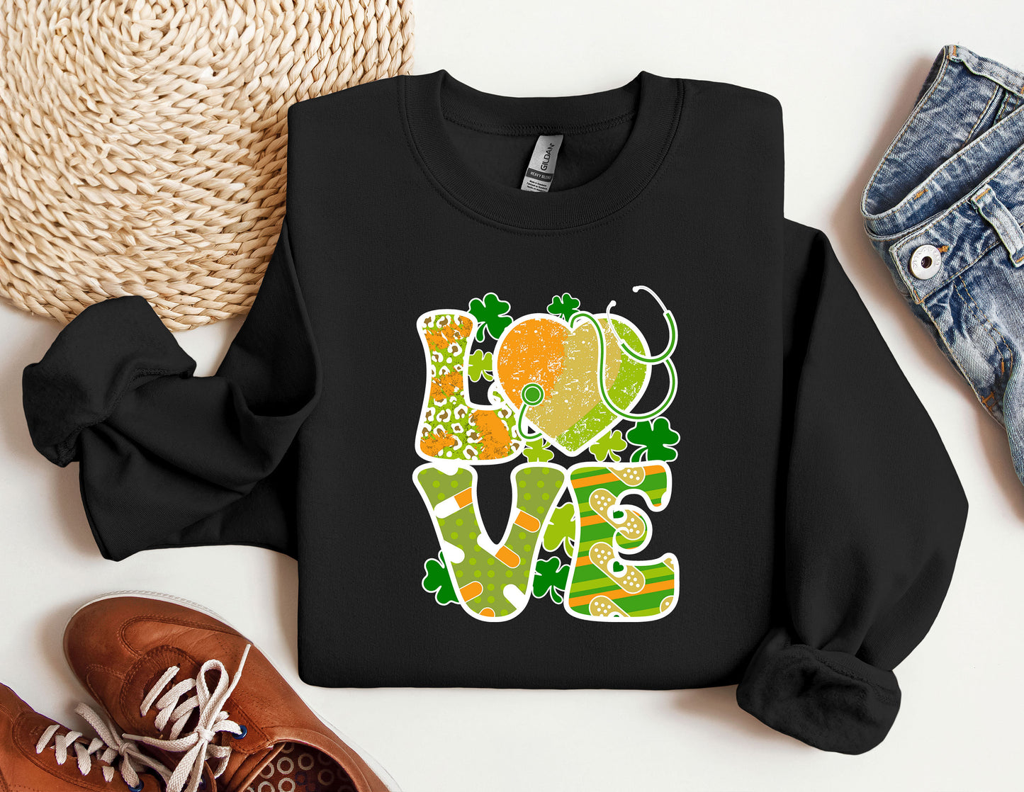 a black sweatshirt with the words love and shamrocks on it