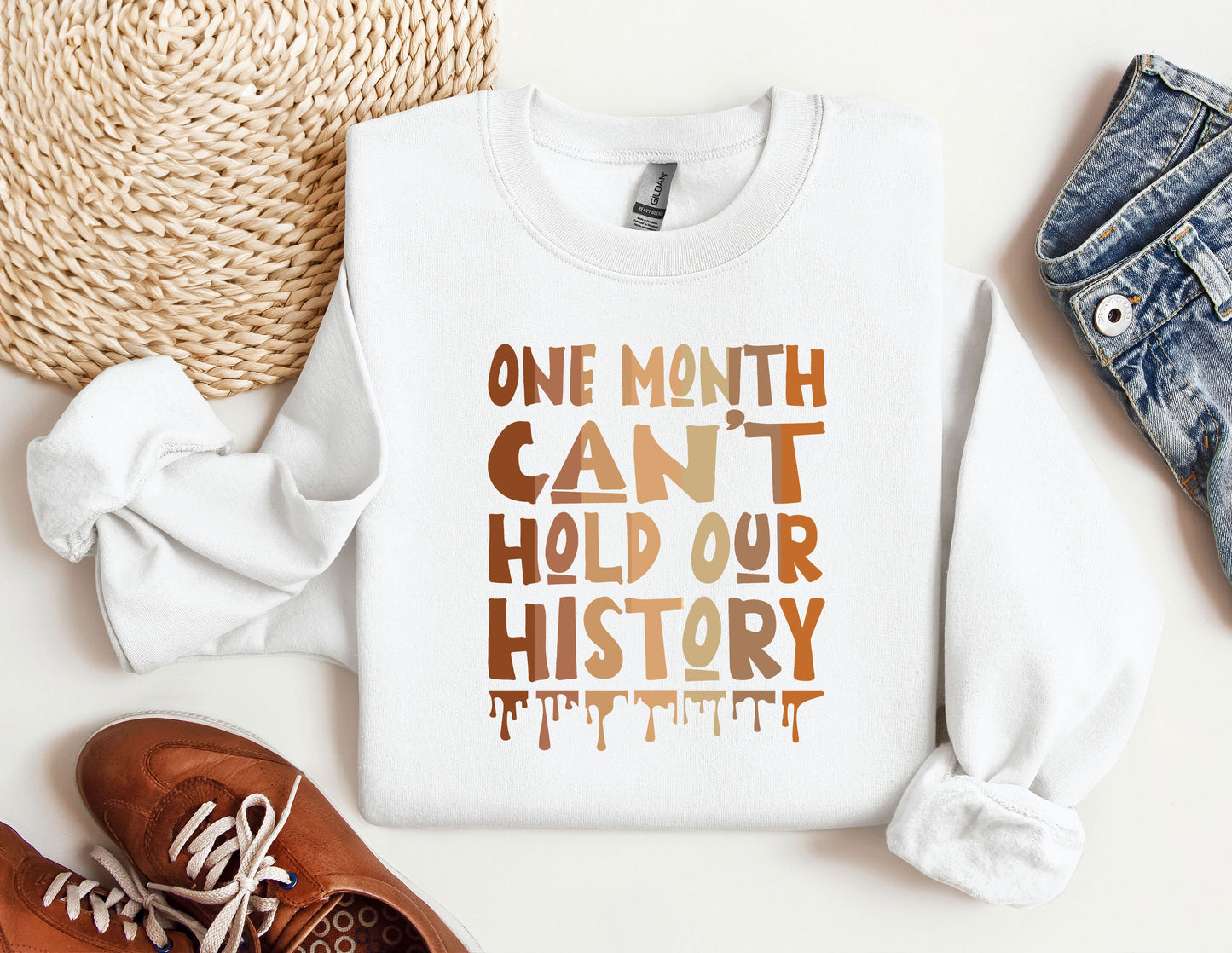 a white sweatshirt with the words one month can&#39;t hold our history printed on