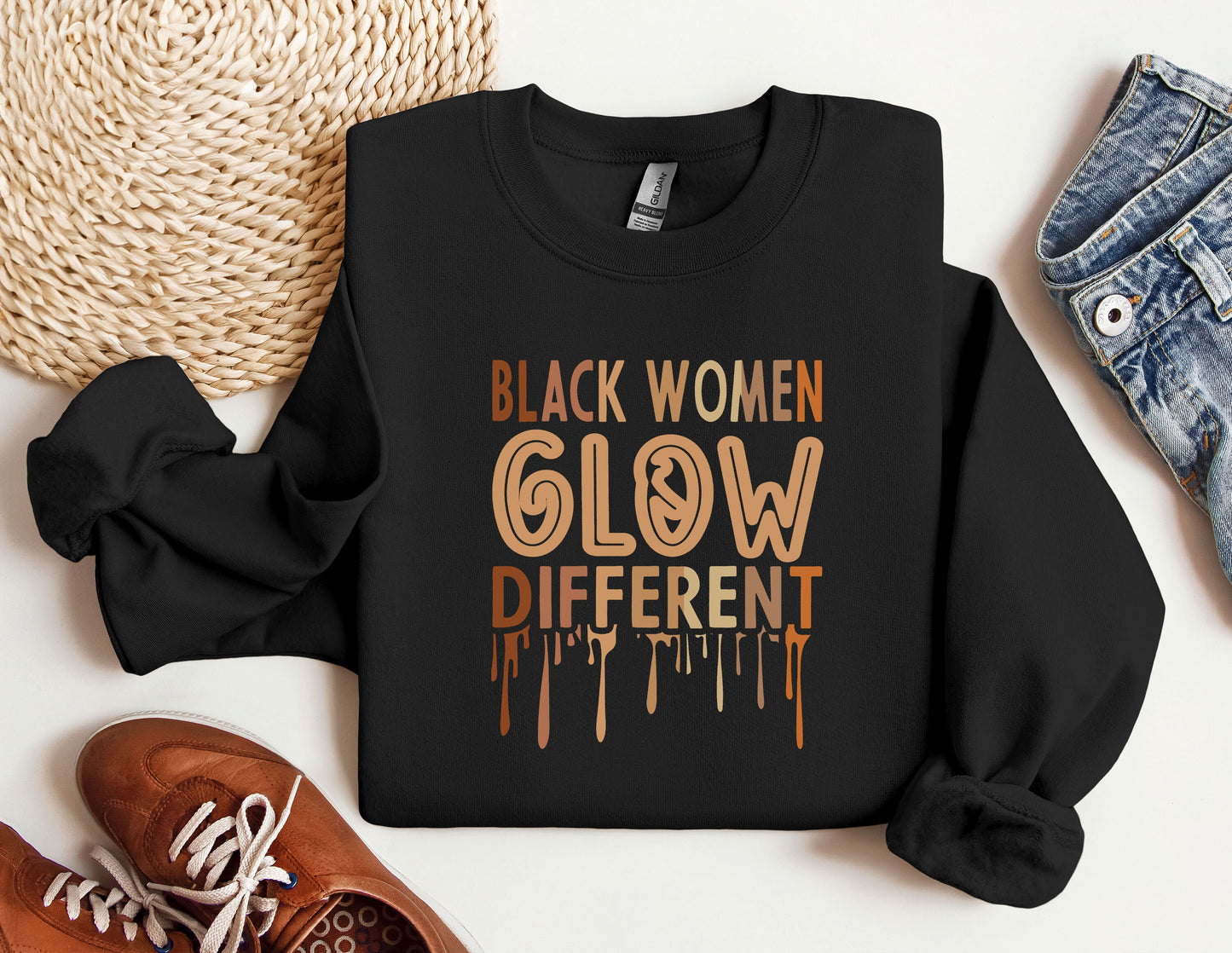 a black sweatshirt with the words black women glow different on it