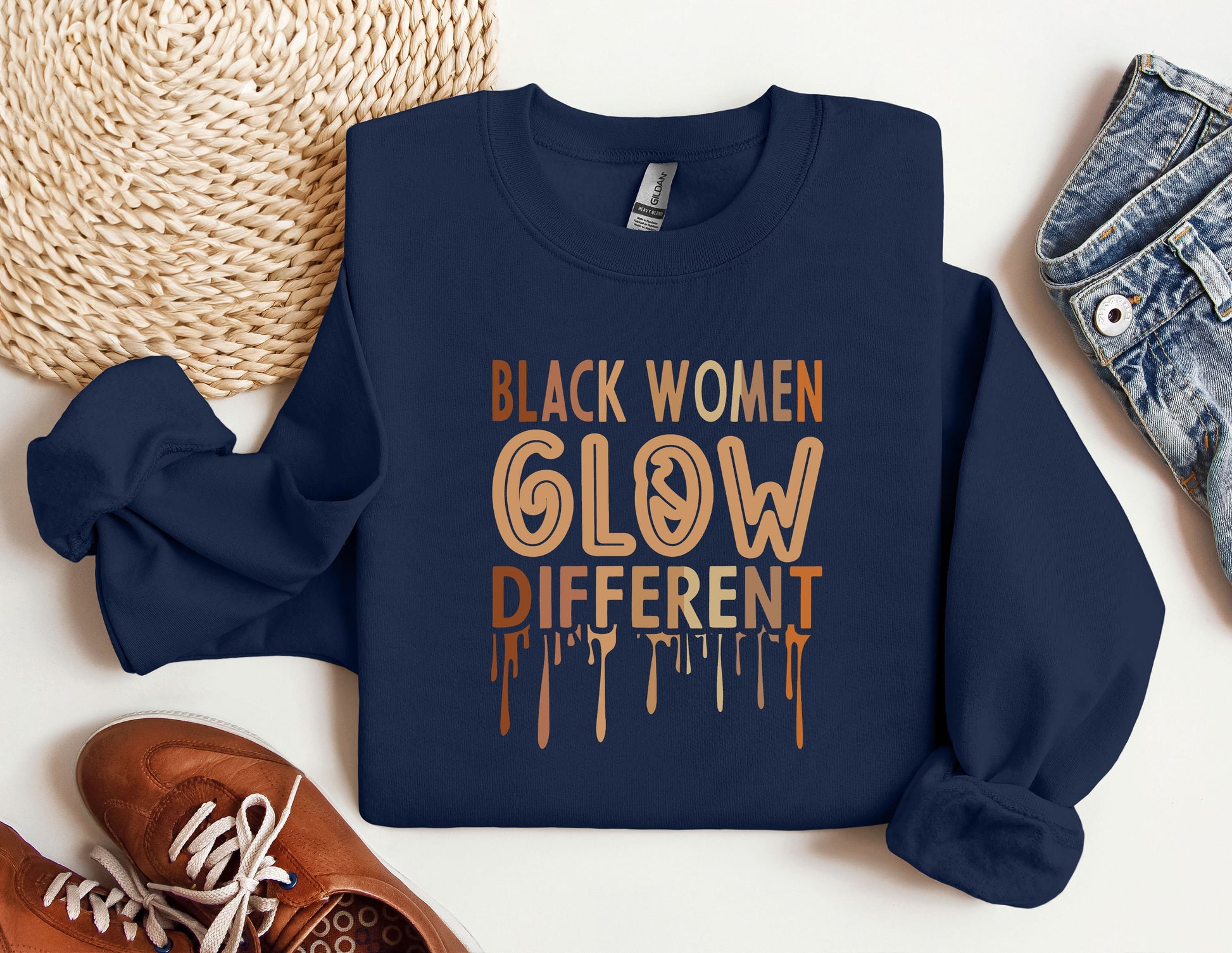 a blue sweatshirt with the words black women glow different on it