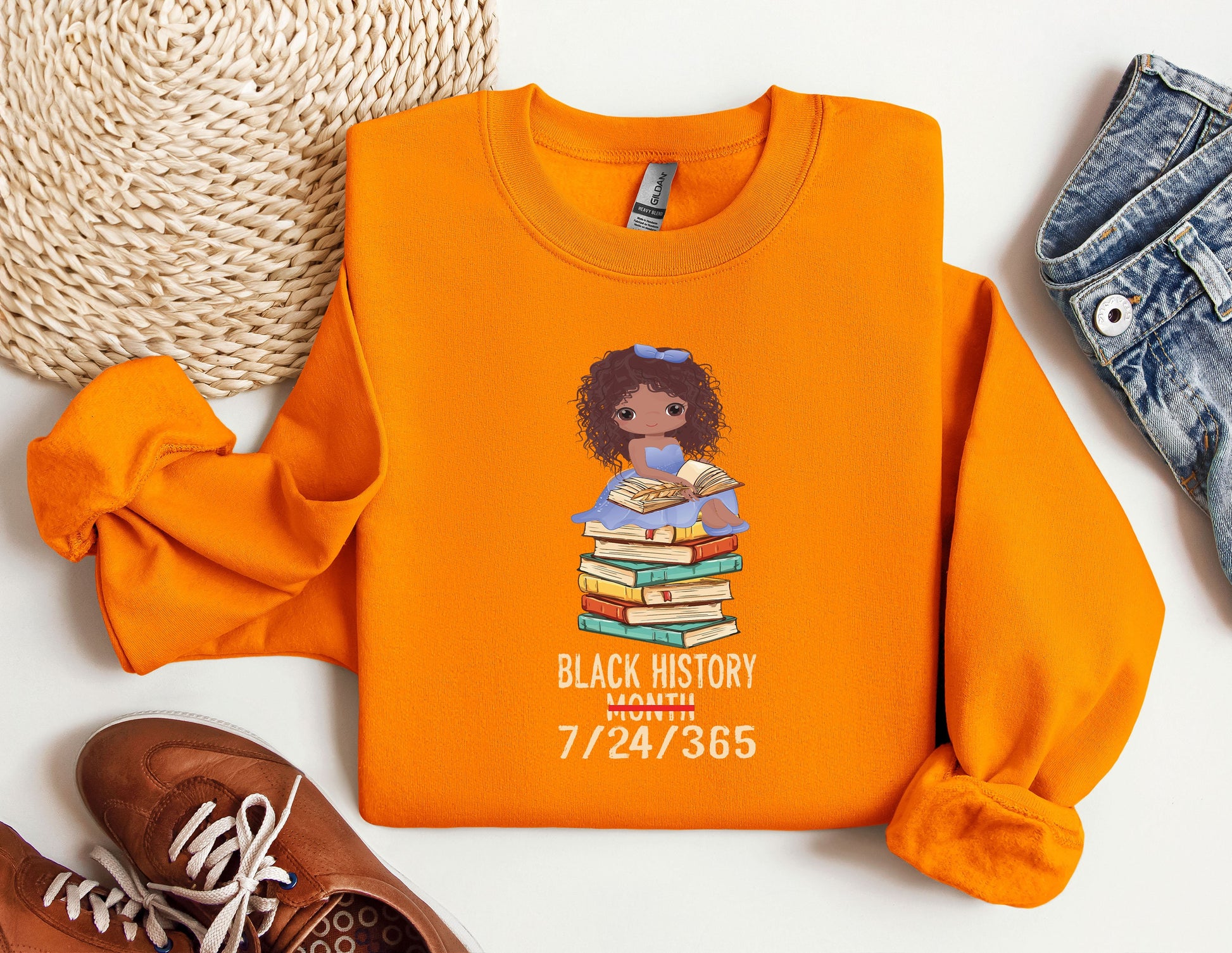 an orange shirt with a black history picture on it