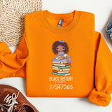 an orange shirt with a black history picture on it