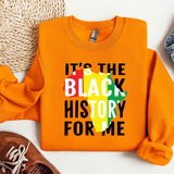 an orange sweatshirt with the words it's the black history for me on it
