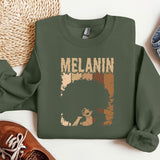 a green sweatshirt with a picture of a woman's hair