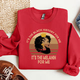 a red sweatshirt with a picture of a woman's face on it