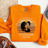 an orange shirt with a picture of a woman's face on it