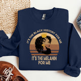 a blue sweatshirt with a picture of a woman's face and the words it
