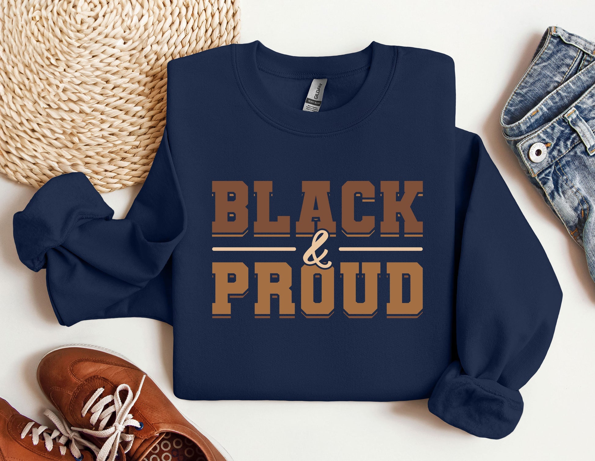 a blue sweatshirt with the words black and proud printed on it