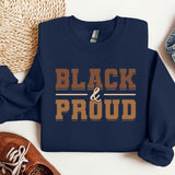 a blue sweatshirt with the words black and proud printed on it