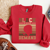 a red sweatshirt with a black by popular demand on it
