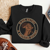 a black sweatshirt with a brown fist on it