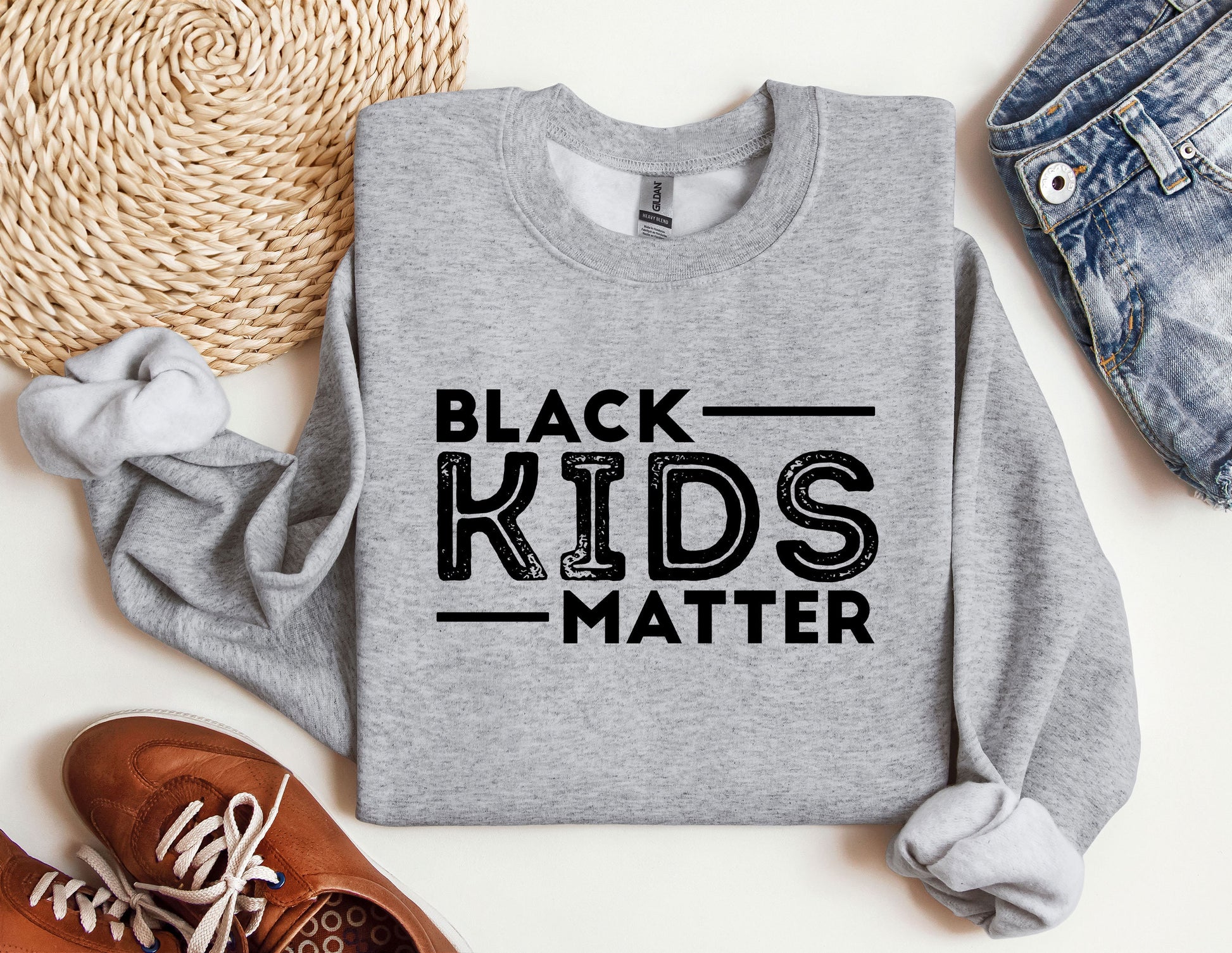 a sweatshirt that says black kids matter on it