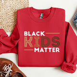 a red sweatshirt with the words black kids matter on it
