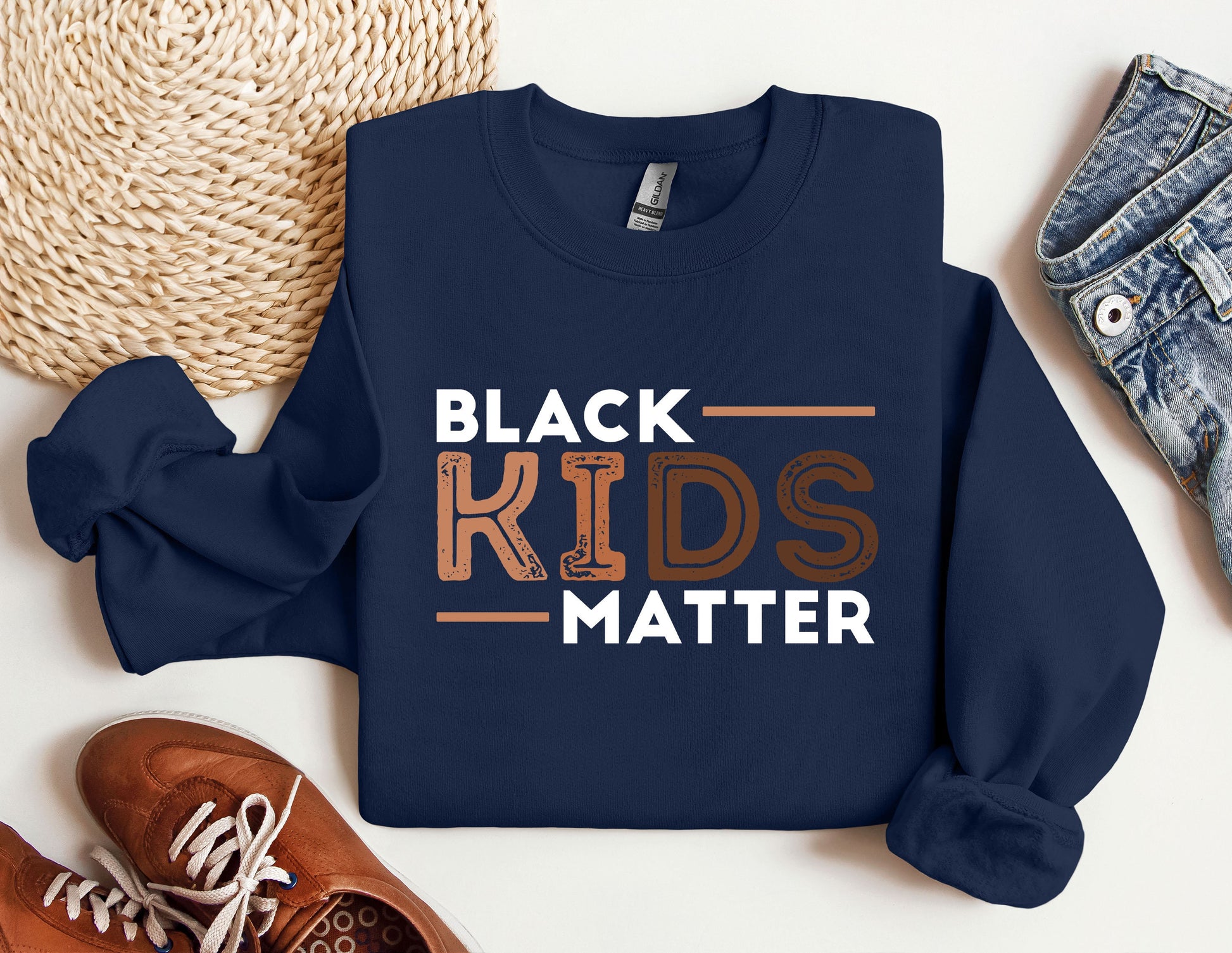 a blue sweatshirt with the words black kids matter on it