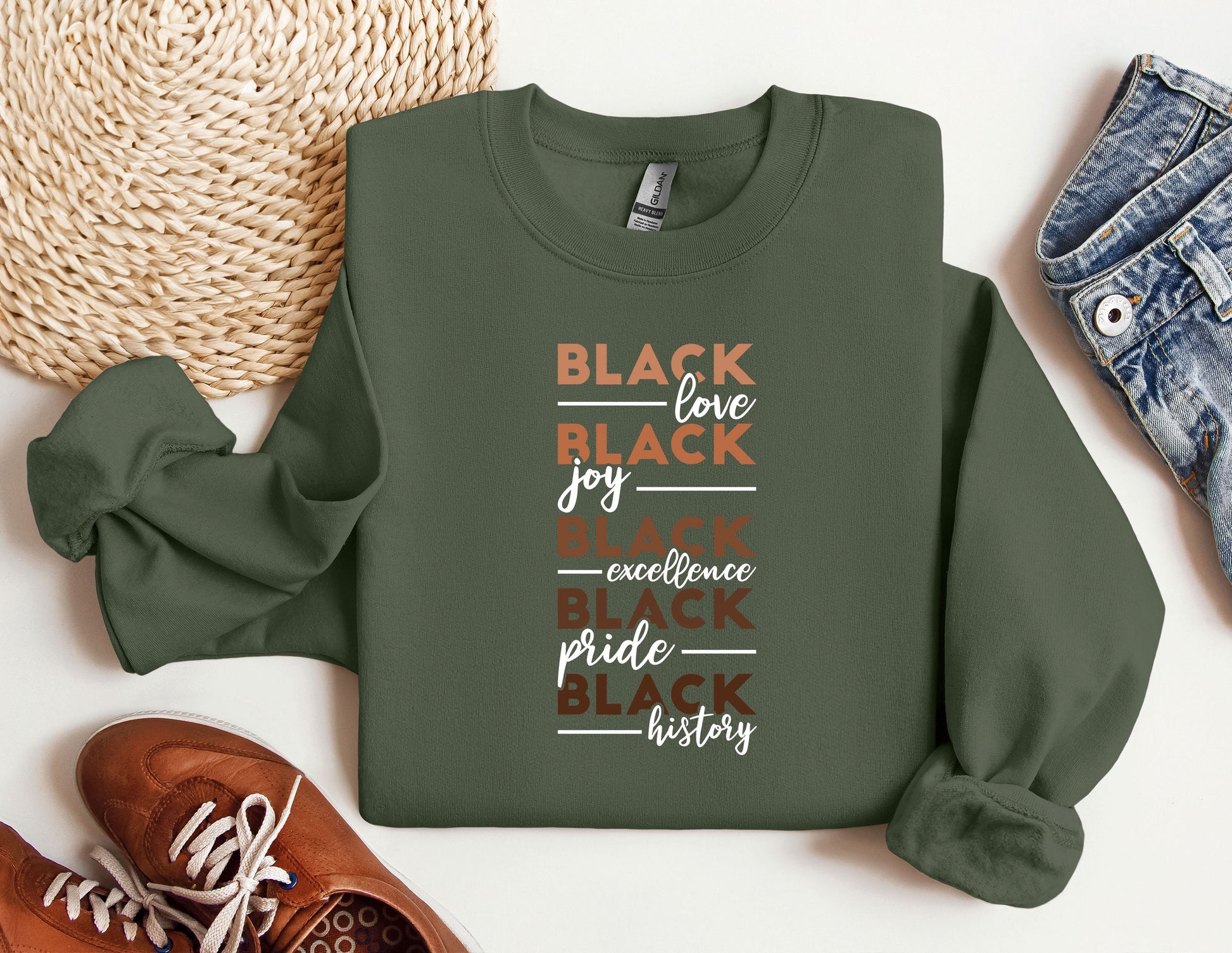 a green sweatshirt with the words black love, joy, experience and pride printed on