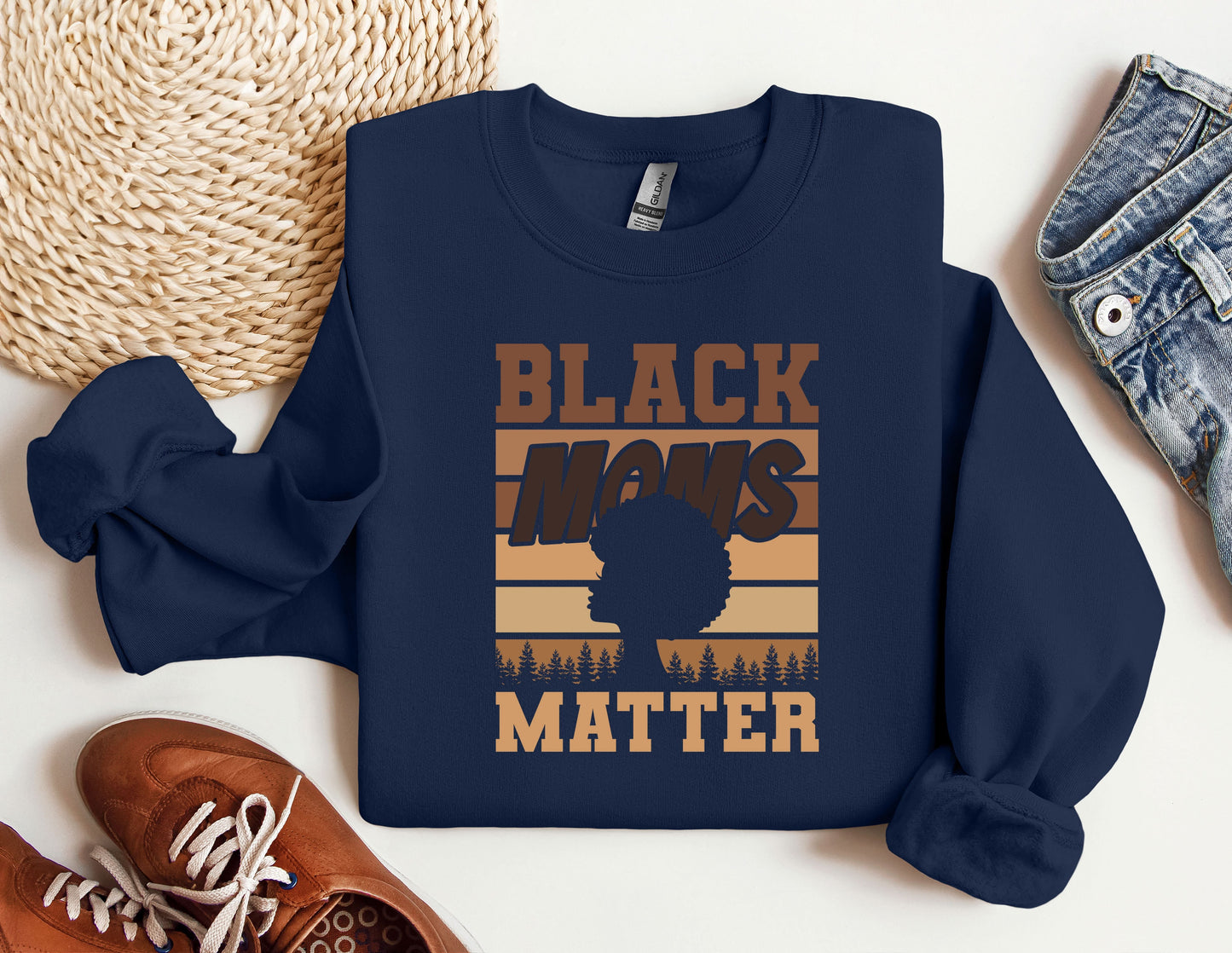 a black man&#39;s matter sweatshirt next to a pair of sneakers