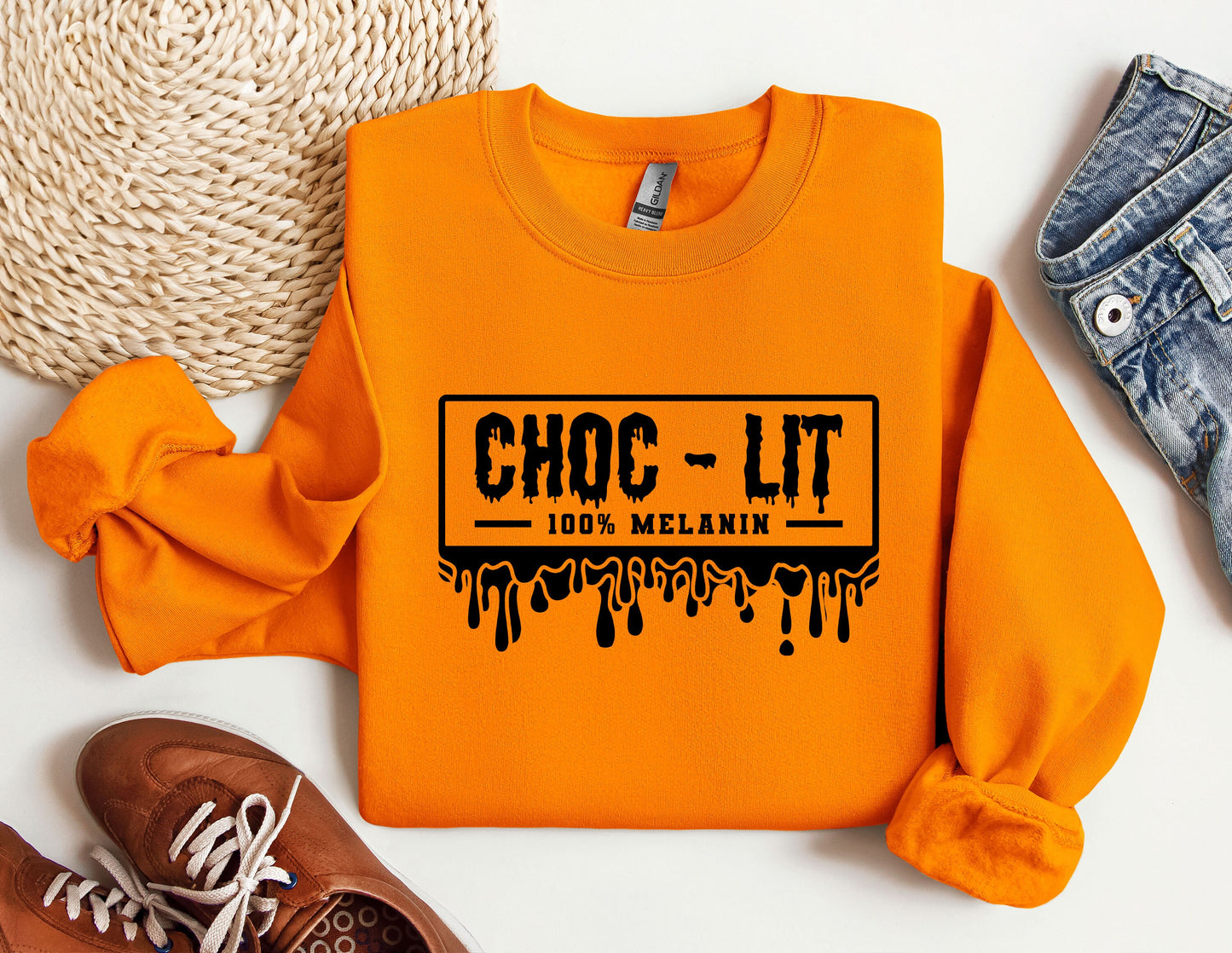 a pair of shoes and an orange shirt with the words choc - lit on