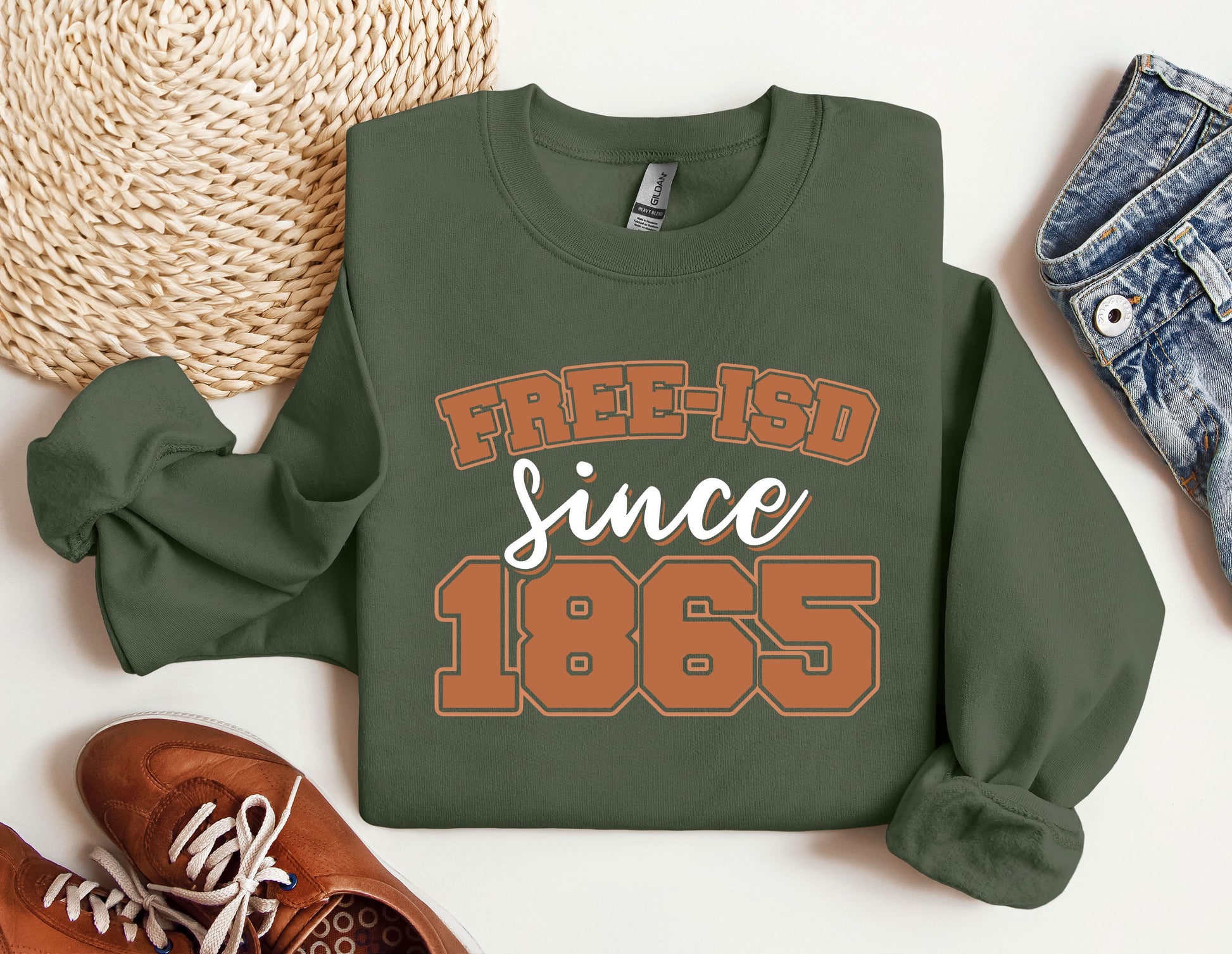 a sweatshirt that says free - isd since 1965 next to a pair of shoes