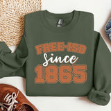 a sweatshirt that says free - isd since 1965 next to a pair of shoes
