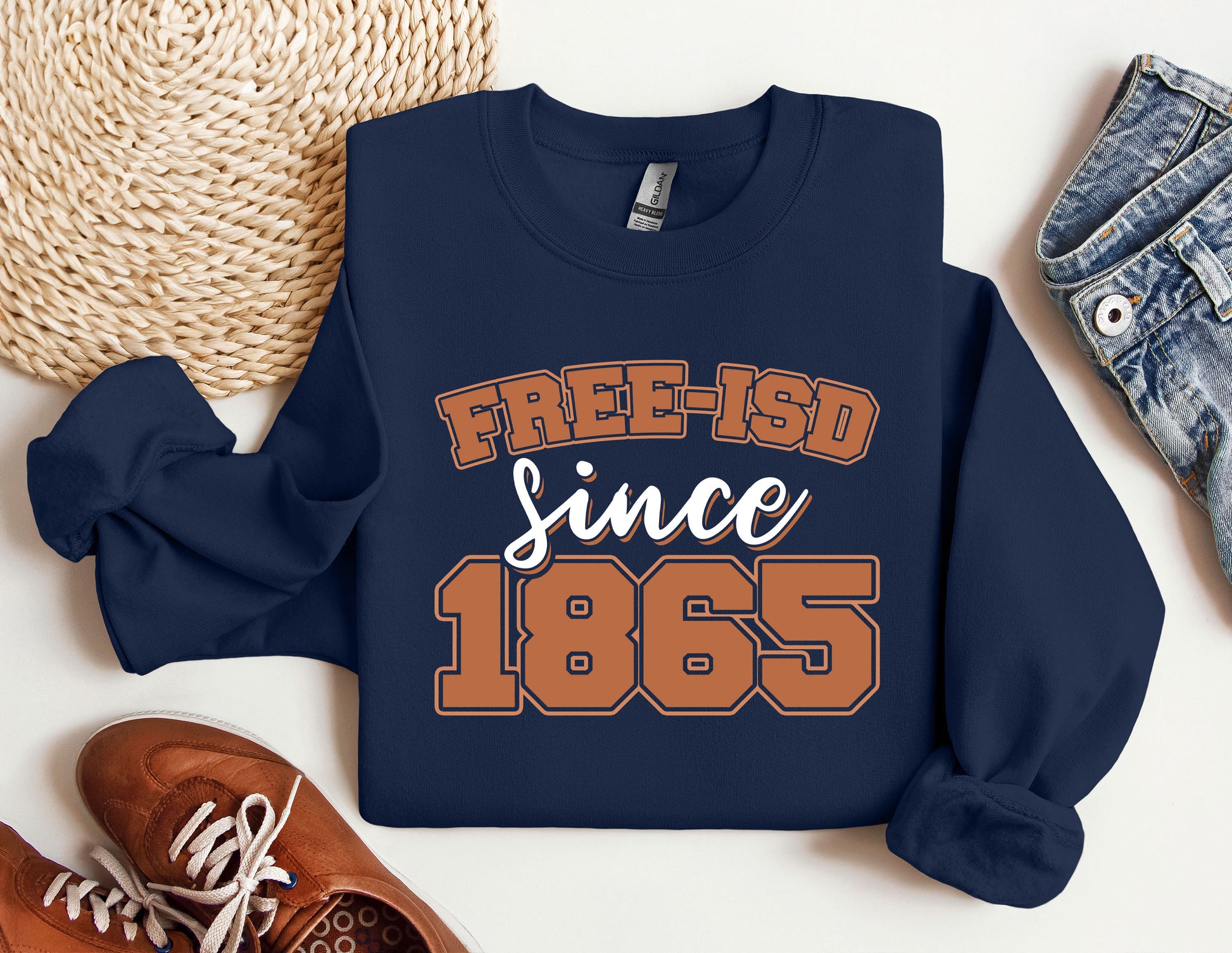 a sweatshirt that says free - isd since 1965 next to a pair of shoes