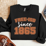 a black sweatshirt that says free - isd since 1965 next to a pair of