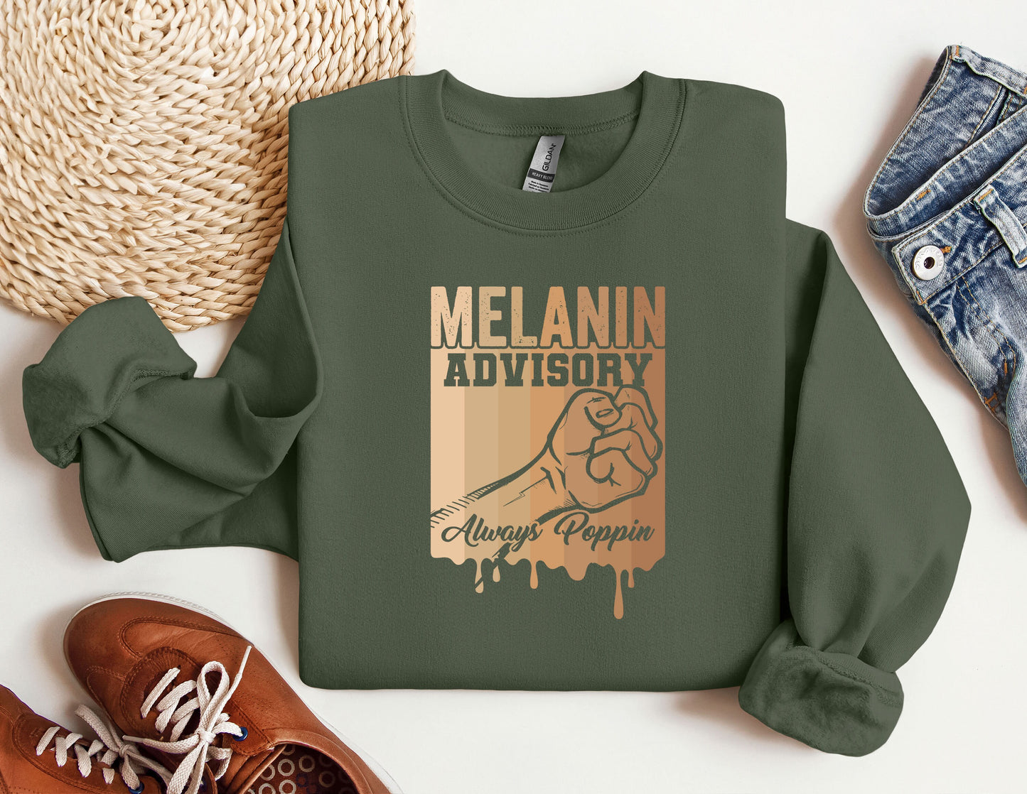 a green sweatshirt with the slogan melanin advisory on it