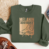 a green sweatshirt with the slogan melanin advisory on it
