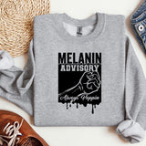 a gray sweatshirt with a black graphic of a fist and the words melanin