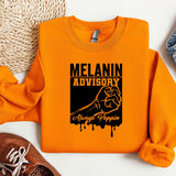 an orange sweatshirt with the slogan melanin advisory on it