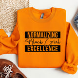 an orange shirt that says normalizing black girl excellence