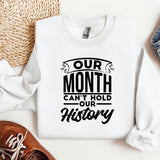 a white sweatshirt with the words our month can't hold our history on it