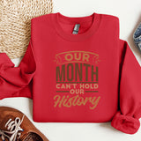 a red sweatshirt with the words our month can't hold our history on it