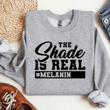 a sweatshirt that says the shade is real and melanin