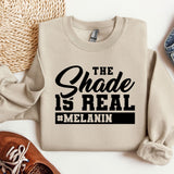 a sweatshirt that says the shade is real and melanin