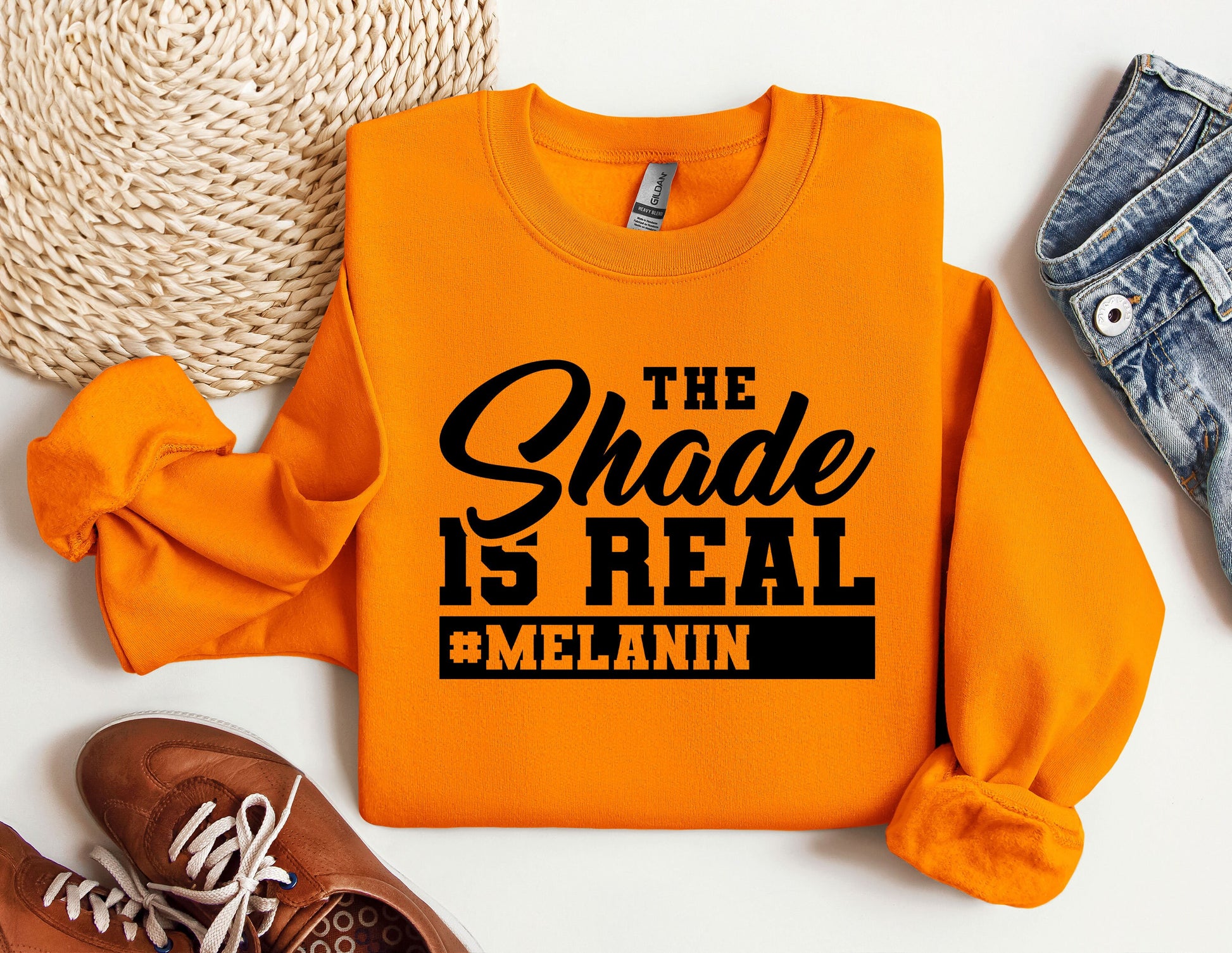 an orange sweatshirt with the words the shade is real on it