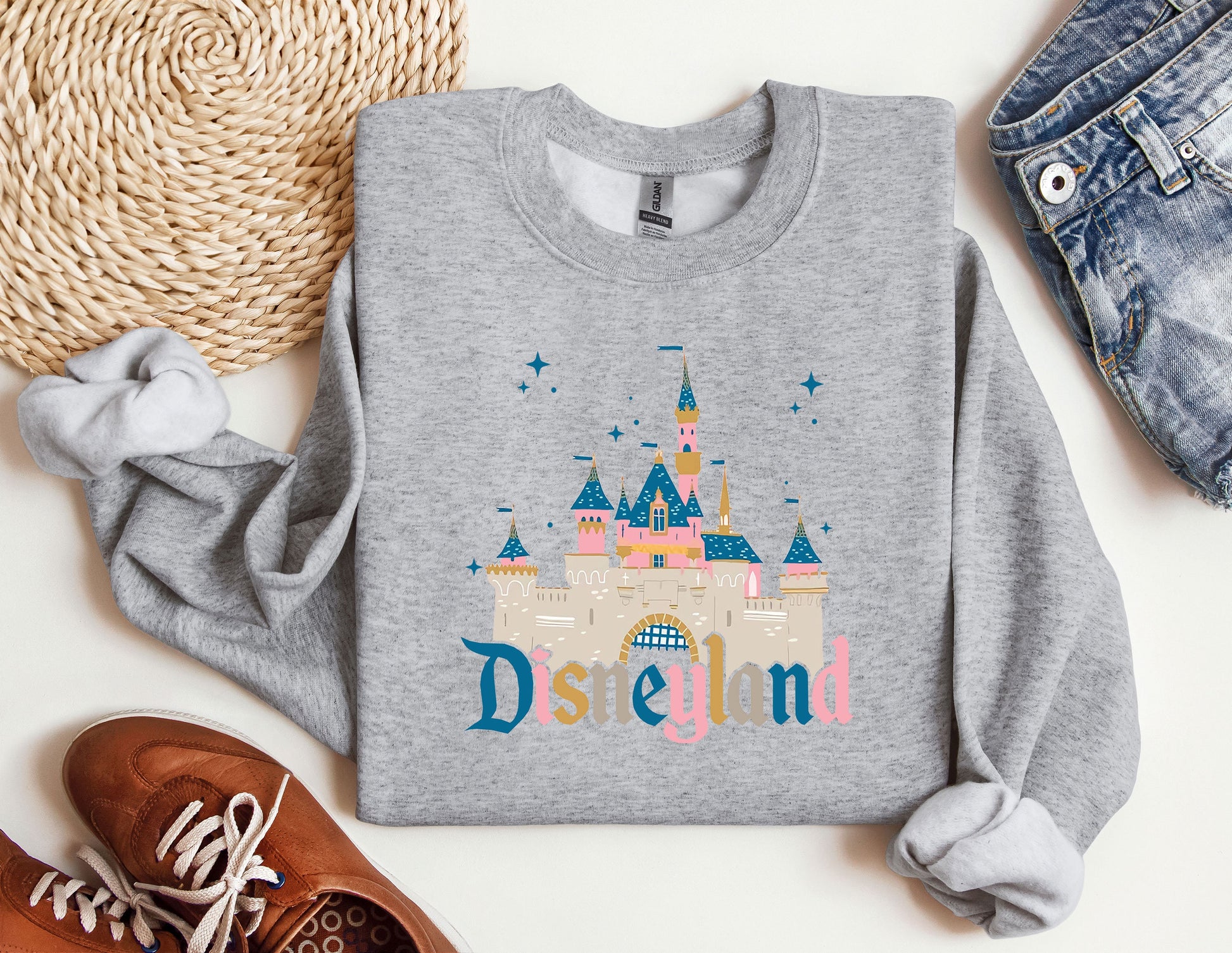 a sweatshirt with the word disneyland printed on it