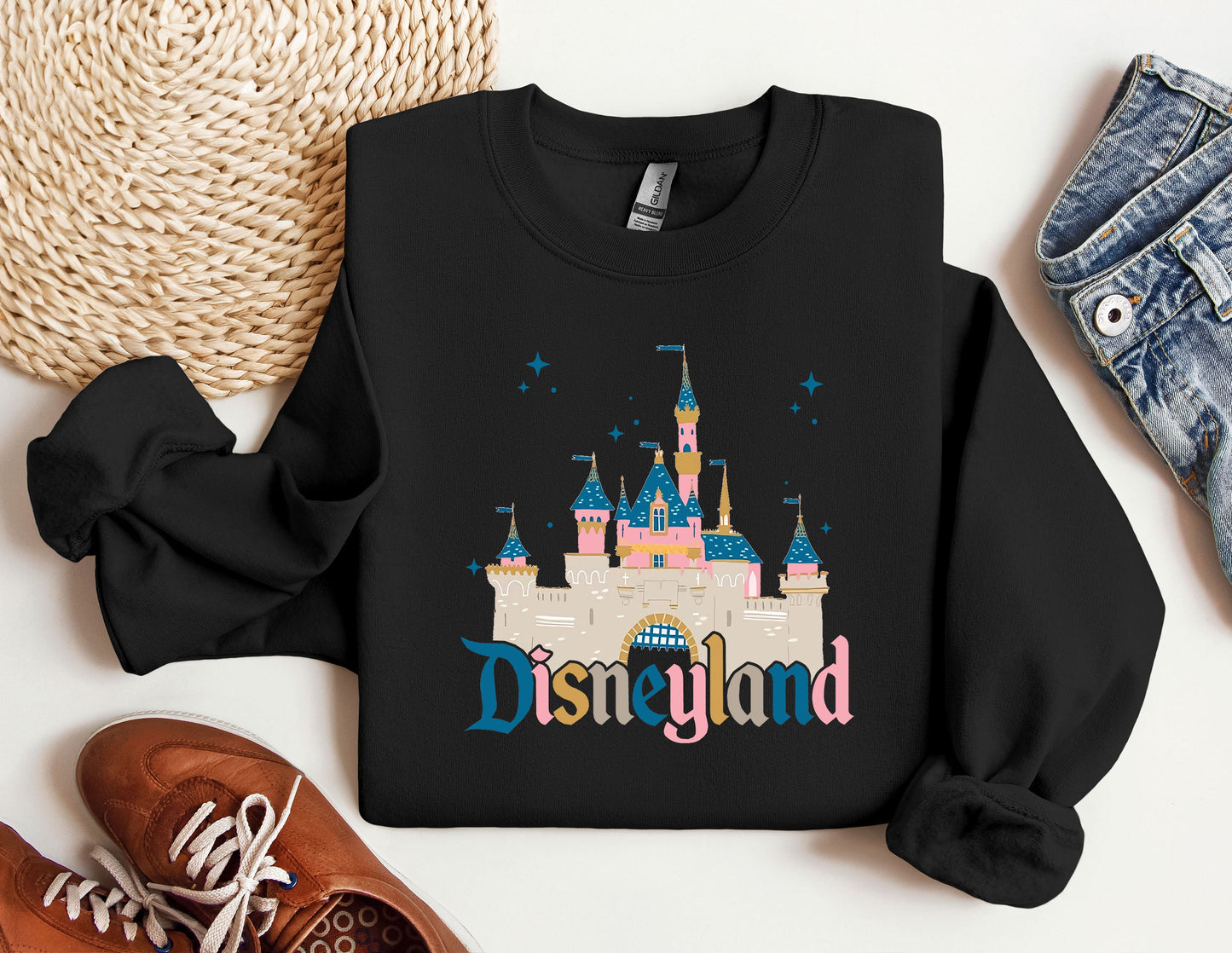 a black shirt with the word disneyland printed on it