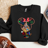 a mickey mouse shirt with mickey mouse heads on it