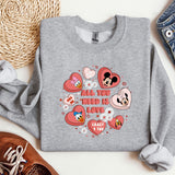 a gray sweatshirt with hearts and mickey mouses all you need is love